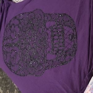 Womans cold shoulder shirt with lace strip down the back and beaded floral skull